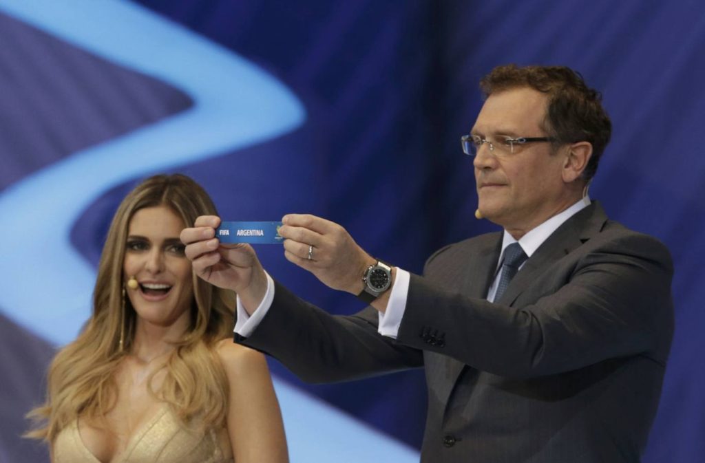 FIFA Secretary General Jerome Valcke holds the slip showing "Argentina" the draw for the 2014 World Cup at the Costa do Sauipe resort in Sao Joao da Mata, Bahia state, December 6, 2013. The 2014 World Cup finals will be held in Brazil from June 12 through July 13.  REUTERS/Ricardo Moraes (BRAZIL  - Tags: SPORT SOCCER SPORT SOCCER WORLD CUP)